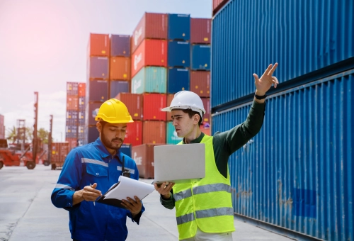 Boots-on-the-ground sourcing professionals coordinating suppliers and logistics at a container terminal