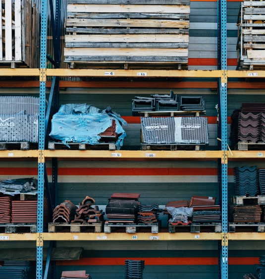 Construction materials stacked and labeled in export warehouse