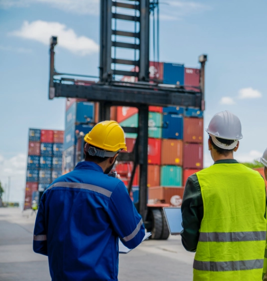 Port logistics professionals monitoring containerized exports