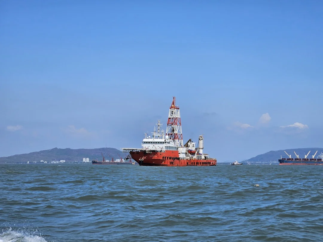 Cargo vessel transporting industrial goods across international waters for global sourcing and export logistics