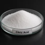 Citric Acid C₆H₈O₇, CAS 77-92-9 white crystalline powder in a petri dish