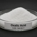 Oxalic Acid; Ethanedioic Acid; C₂H₂O₄, CAS 144-62-7 white powder in a petri dish